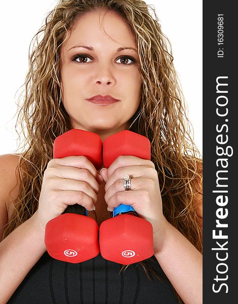 Beautiful 30 year old woman with red hand weights over white background. Beautiful 30 year old woman with red hand weights over white background.