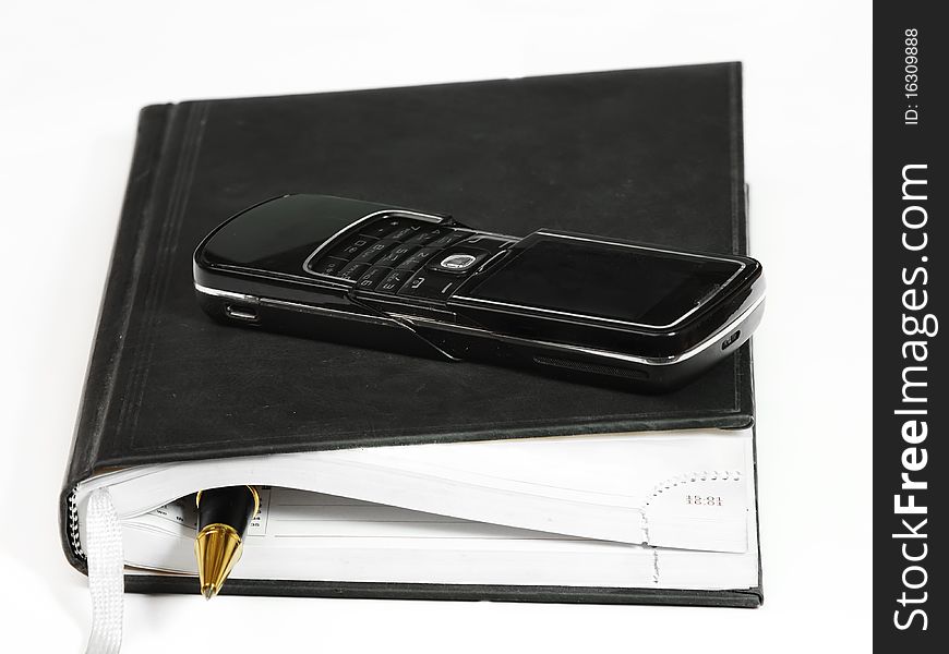 Notebook, phone  and pen for writing notes. Business note concep. Notebook, phone  and pen for writing notes. Business note concep.