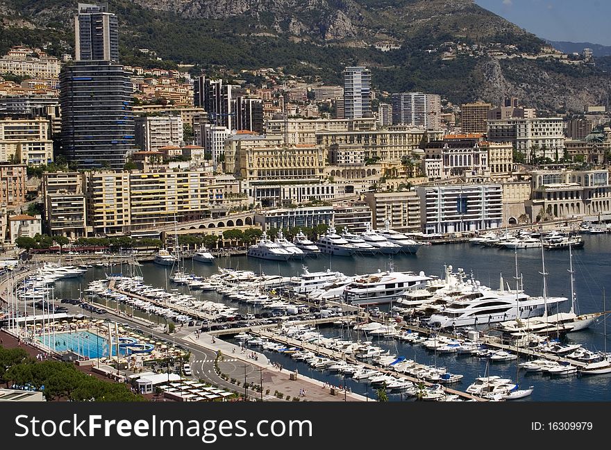 Landscape view of Monaco and yachts in the marina. Landscape view of Monaco and yachts in the marina.