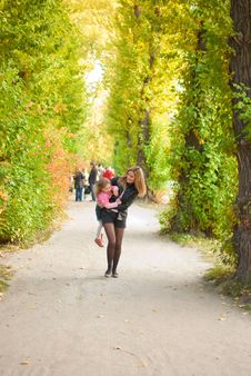 Family In Autumn Park Royalty Free Stock Photo