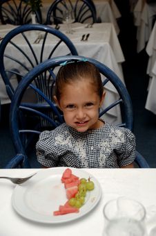 Child At Restaurant Table Royalty Free Stock Photography