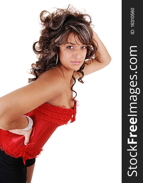 Closeup of a beautiful young woman in a red corset and long brunet curly hair for white background. Closeup of a beautiful young woman in a red corset and long brunet curly hair for white background.