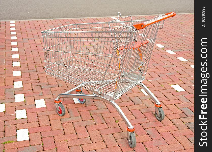 Shopping trolley in parking bay.