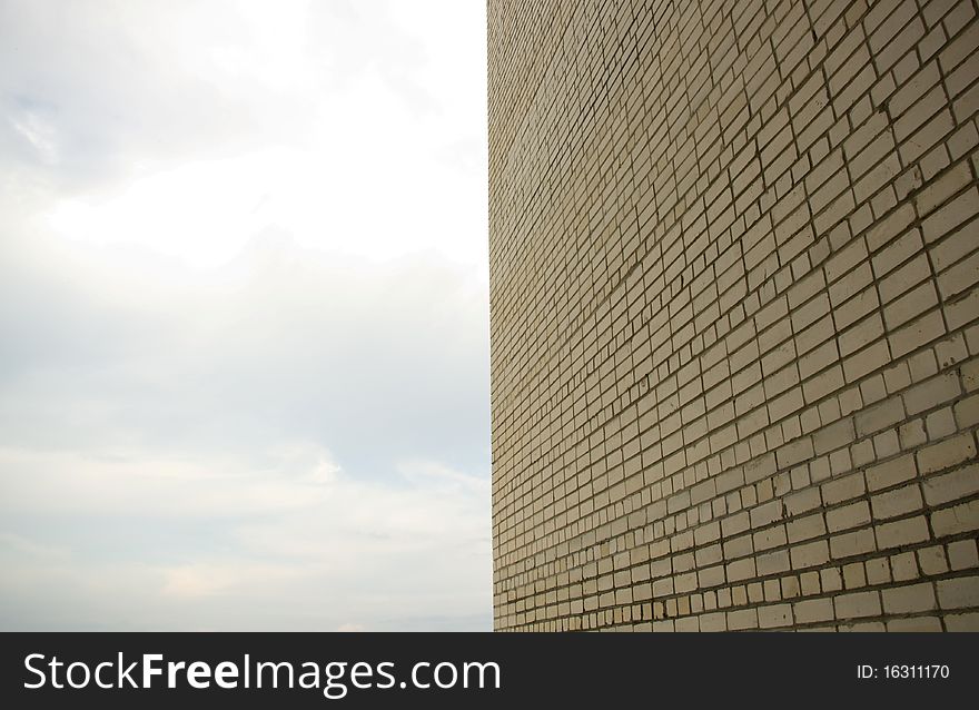 White brick wall against the sky