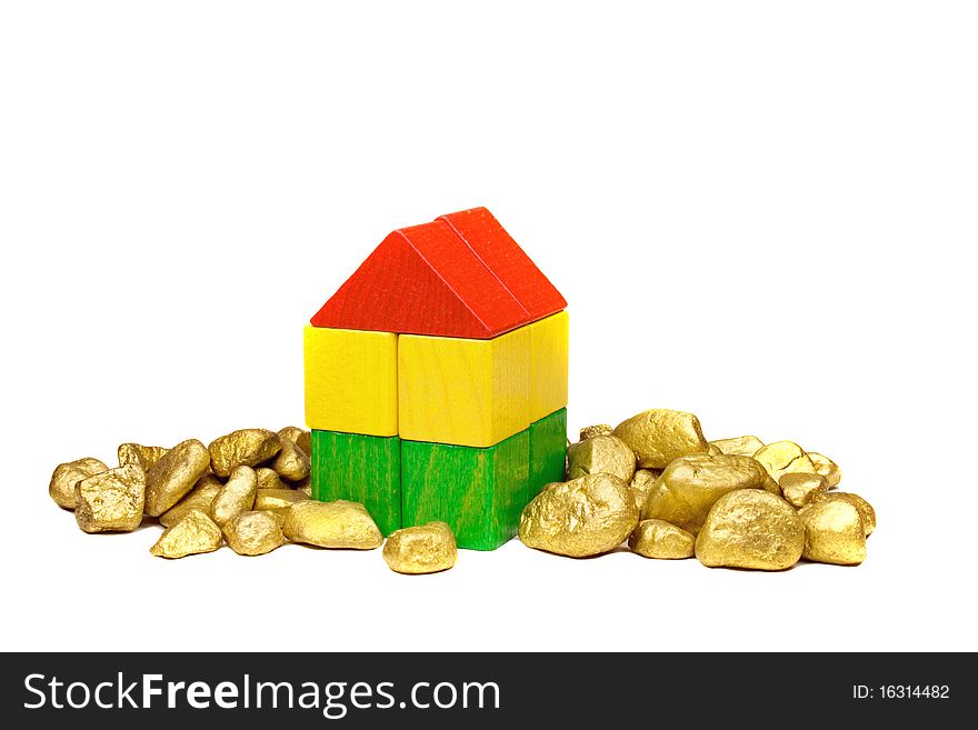 Toy house with gold nuggets. Toy house with gold nuggets