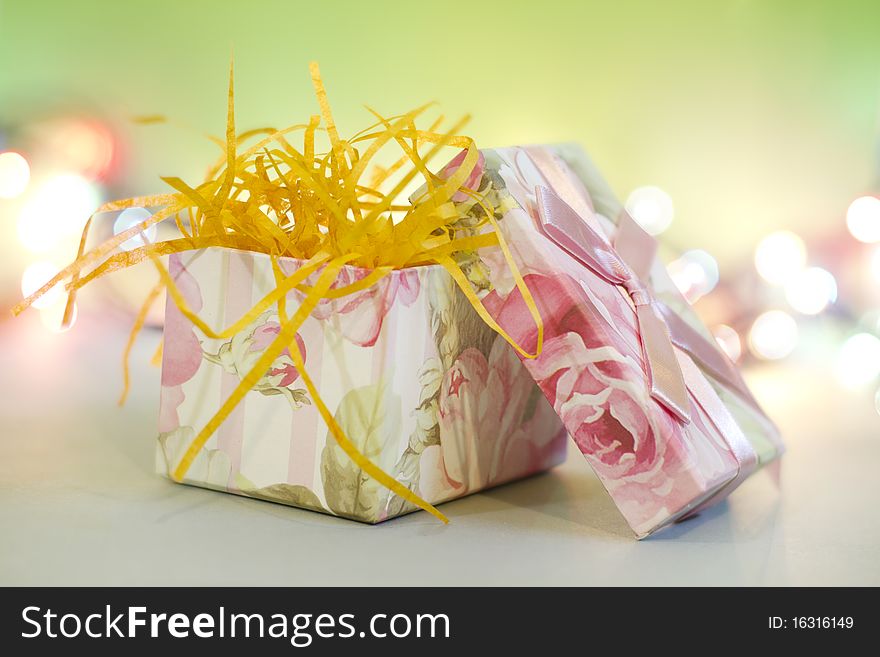 Gift box with light dots background