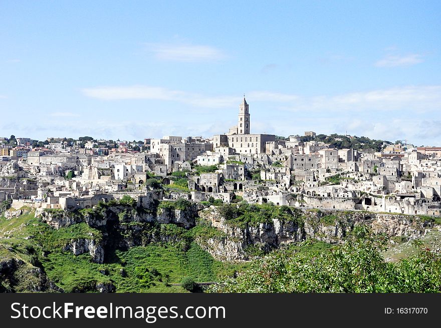 One of the most enchanting places in the world - which until recently was relatively unknown - is the ancient city of Matera, located in the Basilicata region in southeastern Italy. Matera is a unique example of a cultural tradition and civilization which stretches back to the Neolithic age. The old city was created out of a rocky ravine. The numerous natural caves in Matera were the first houses of the Neolithic inhabitants of the region, who transformed the natural landscape into new forms of architecture.