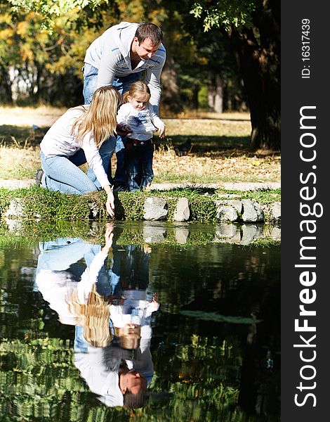 Happy family in autumn park. Happy family in autumn park