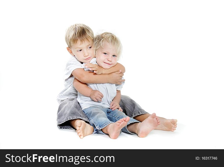 Studio shot of embracing brother and sister