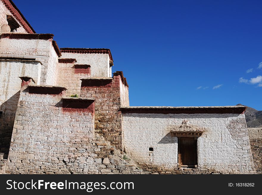 Scenery of typical tibetan buildings with blue skies as backgrounds in Tibet