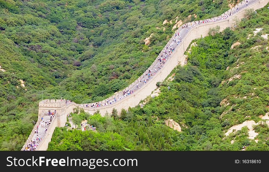 The Chinese great wall at Badaling in the mountains in the north of the capital Beijing with a lot of tourists. The Chinese great wall at Badaling in the mountains in the north of the capital Beijing with a lot of tourists