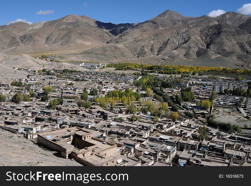 Scenery of a small city at the foot of mountains in Tibet. Scenery of a small city at the foot of mountains in Tibet