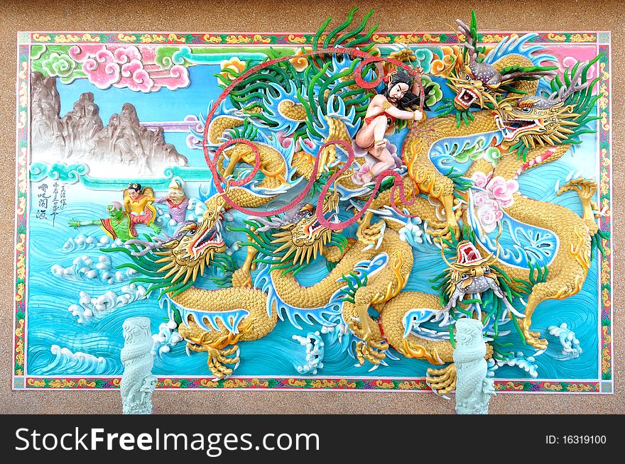 Colorful chinese style stucco on wall.