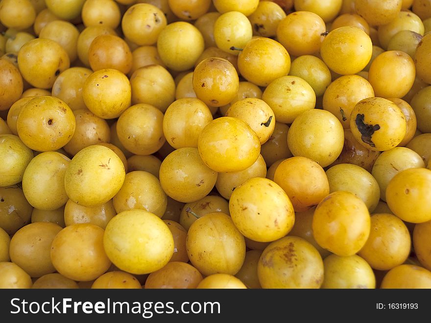 Yellow plums at a fruit market