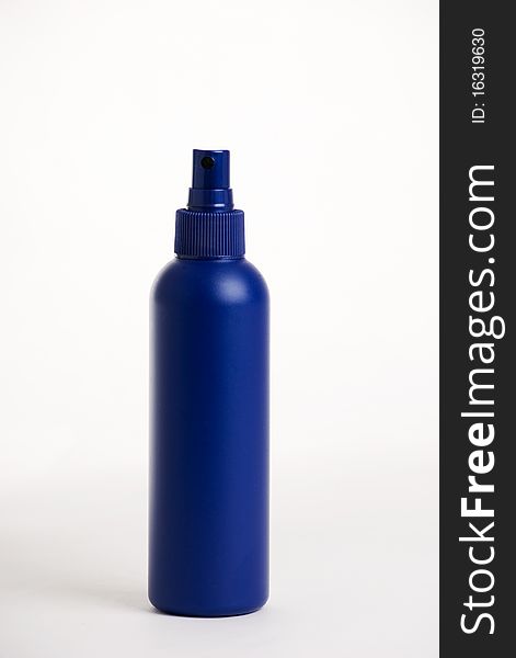 A vertical image of a blue plastic product spray bottle against a white background. A vertical image of a blue plastic product spray bottle against a white background