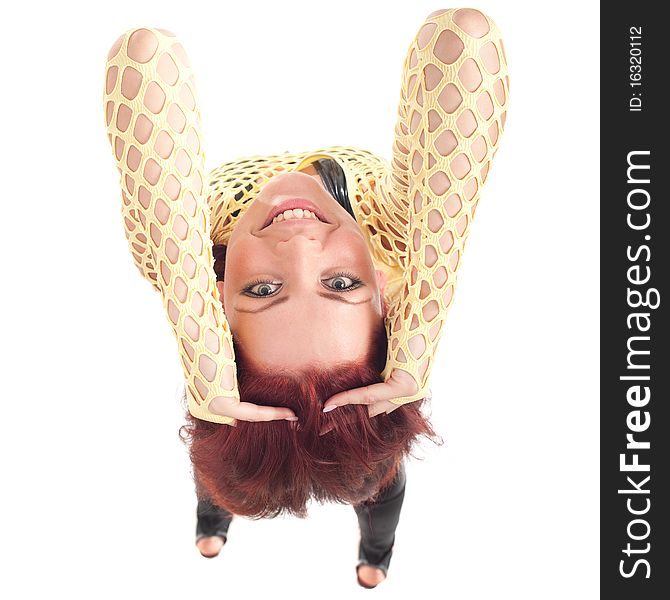 Young beautiful fashion model with red hair and a fishnet shirt. Young beautiful fashion model with red hair and a fishnet shirt.