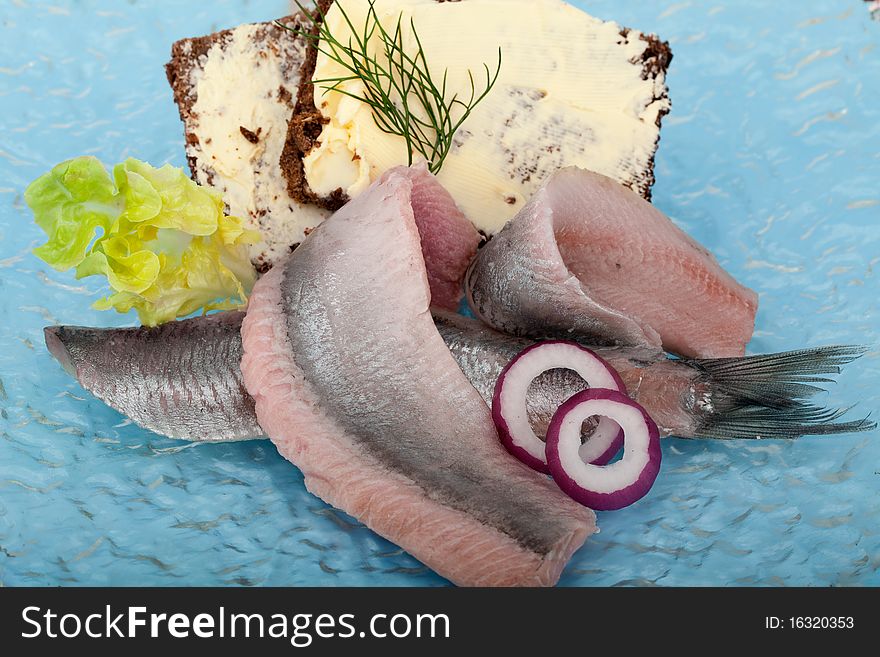Portion of typical Dutch herring on the plate