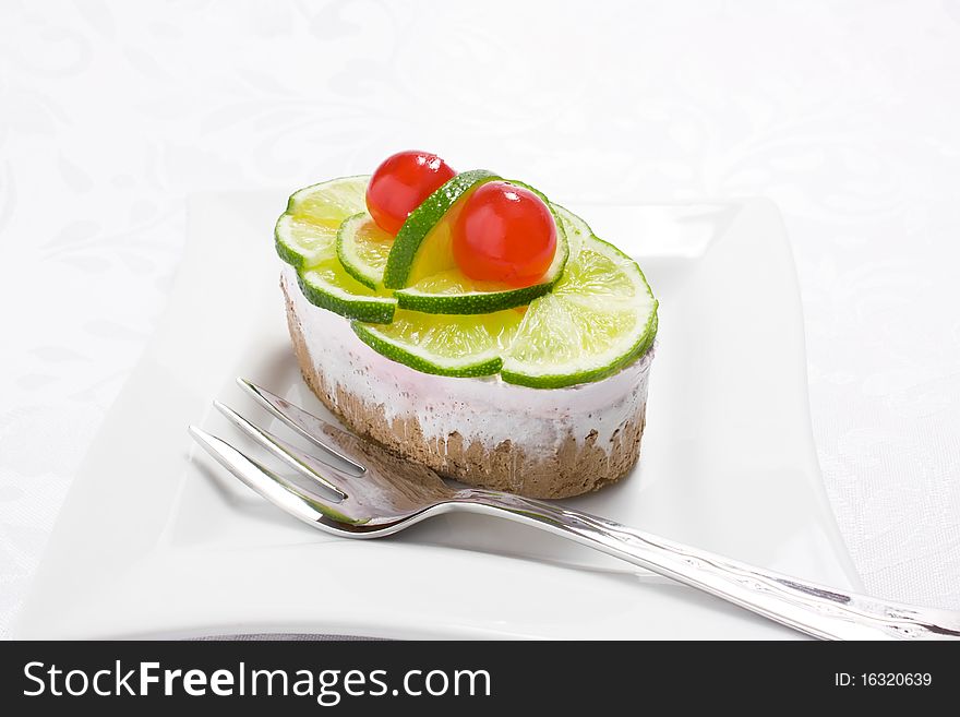 Sponge cake with lime and cherry