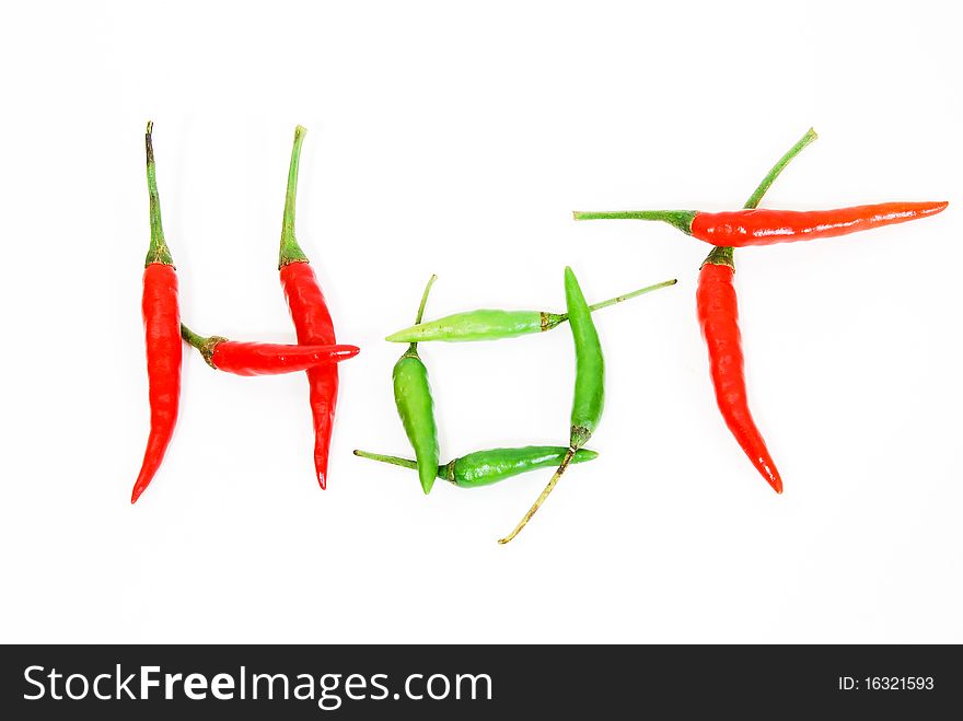 Letter made from red hot chili peppers isolated on seamless white background