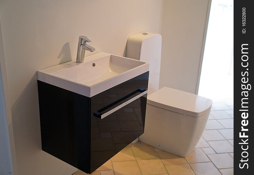 Details of a modern trendy contemporary designer bathroom in black and white. Details of a modern trendy contemporary designer bathroom in black and white