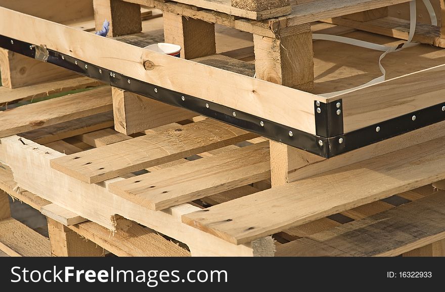 An image of a pile of wooden pallets used to transport goods by road and railway. This material will be recycled as chip board. An image of a pile of wooden pallets used to transport goods by road and railway. This material will be recycled as chip board.