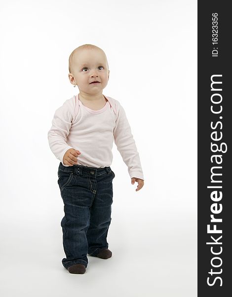 Child and his first short step, on white background.