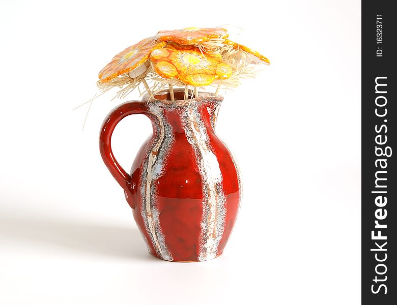 Bouquet of flowers made of ceramic in a vase on a white background