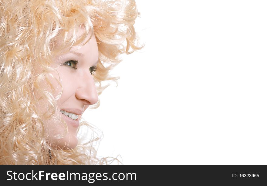 Portrait of a young smiling girl with blond hair. The photograph is a free space for your content.