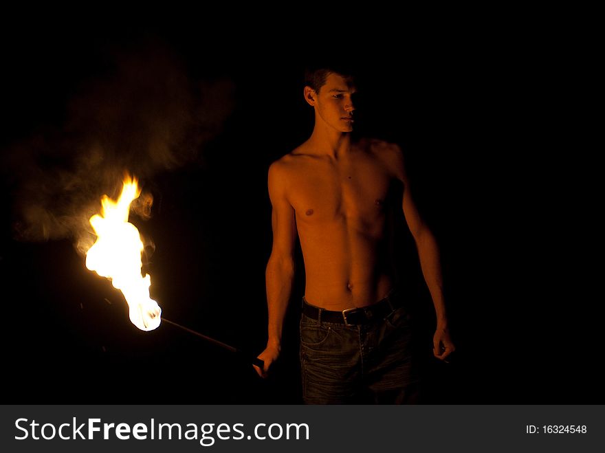 Fire-eater performance on a street