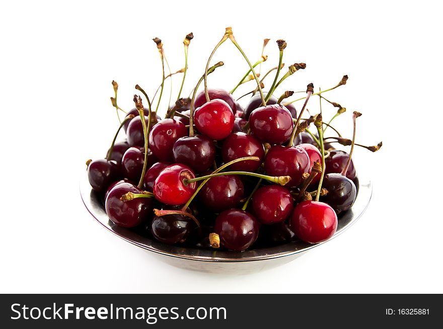 Small metal bowl of freshly picked red cherries. Small metal bowl of freshly picked red cherries