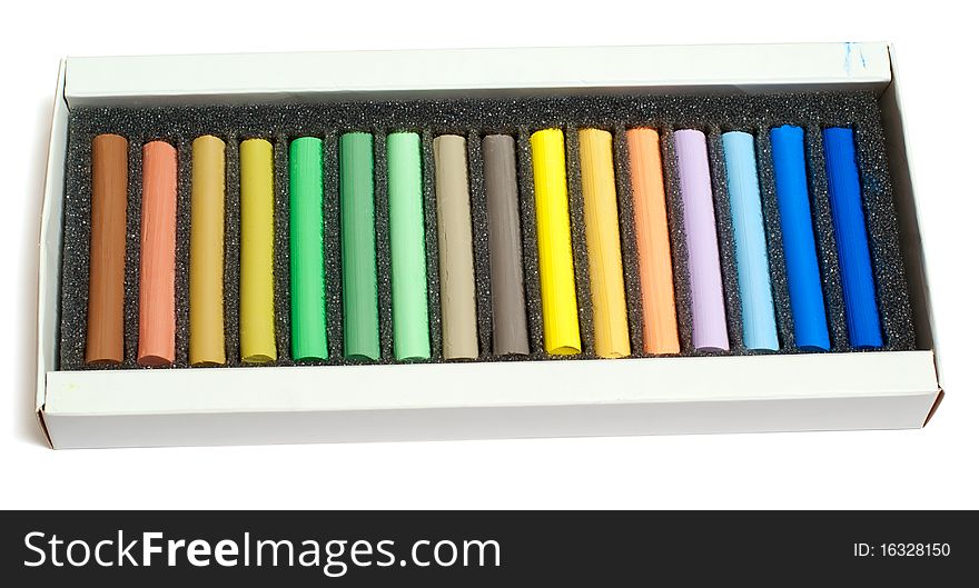 Set of crayons in the box isolated on white