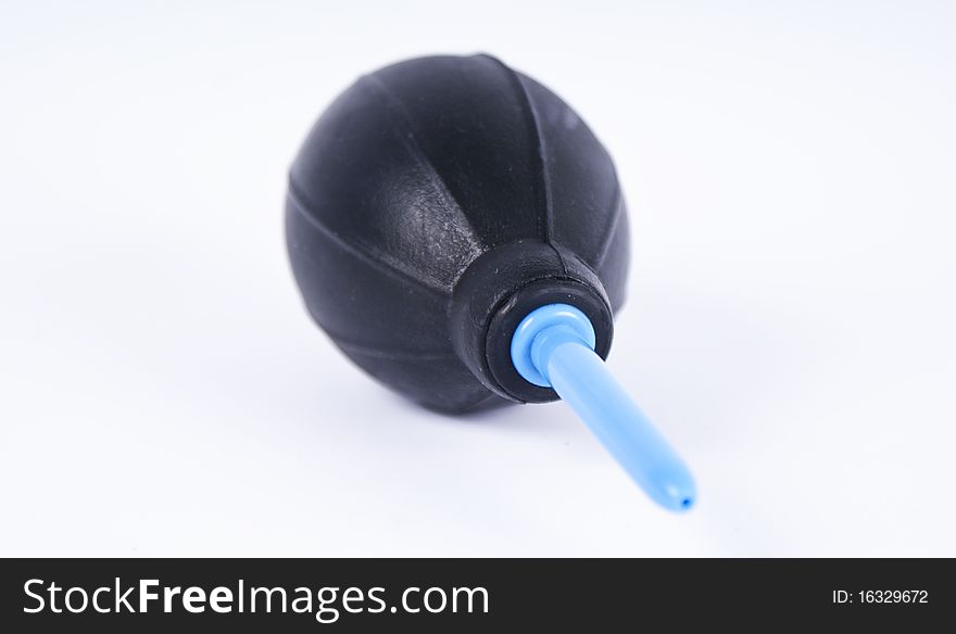 Black rubber air ball pump on white background.