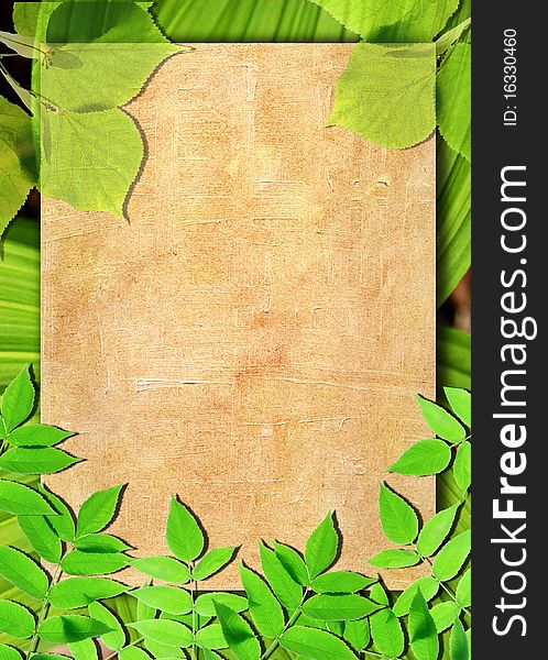 Lined paper framed by natural green leaves background. Lined paper framed by natural green leaves background