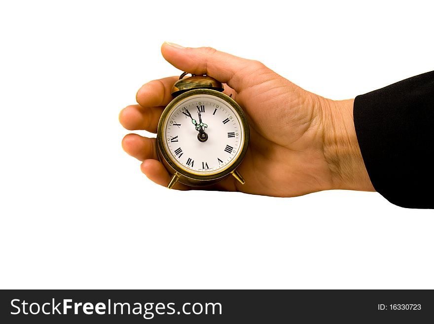 Hand is holding a clock. Hand is holding a clock