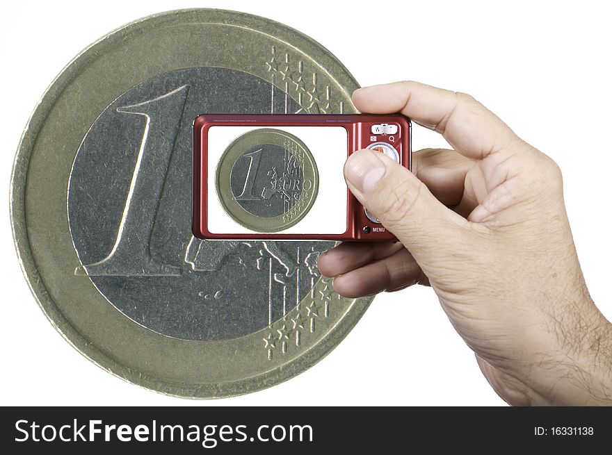 This image shows a camera photographing a euro. This image shows a camera photographing a euro
