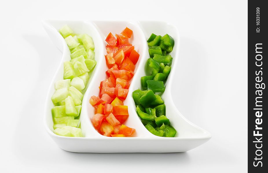 Sliced Tomatoes, Cucumber and Capsicum Salad served in a platter. Sliced Tomatoes, Cucumber and Capsicum Salad served in a platter