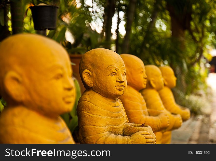 Thai monk sculpture on street