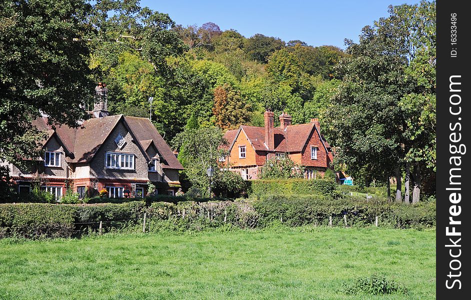 An English Rural Landscape with Cottages in the trees. An English Rural Landscape with Cottages in the trees
