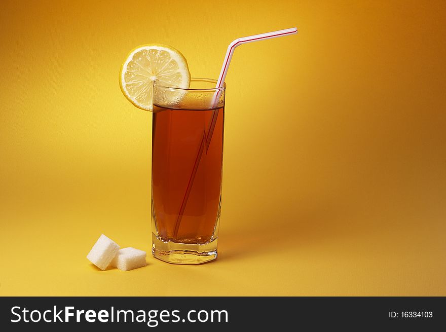 Glass of tea with lemon and sugar