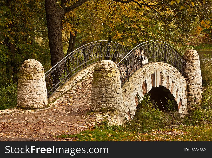 Autumnal image of the bridge over the river. Autumnal image of the bridge over the river