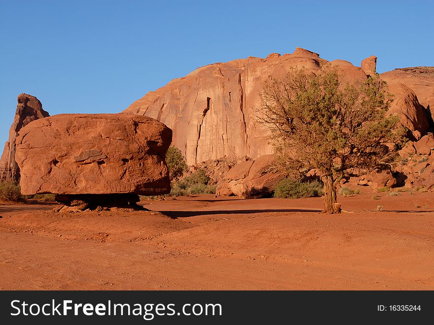 An image of a unique rock formation from the deserts of Utah. Blue sky background. An image of a unique rock formation from the deserts of Utah. Blue sky background.