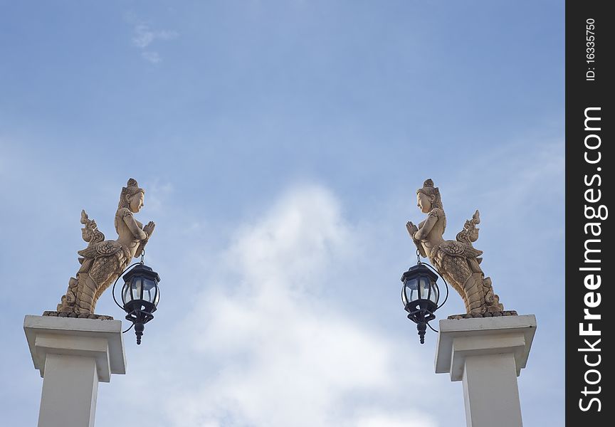 Pair Of Angel Statues Hold The Lamps
