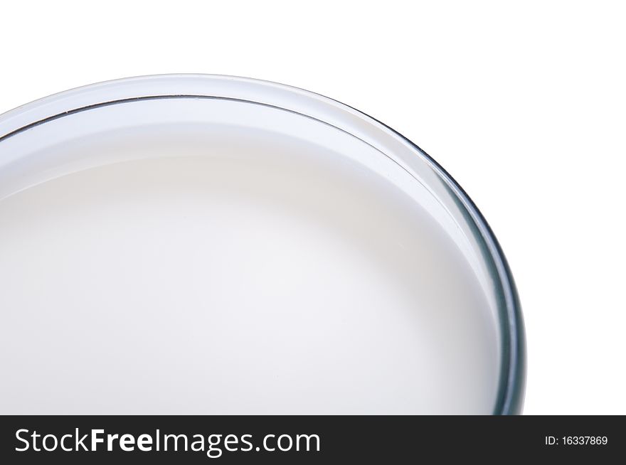 Glass of milk close-up, isolated on white