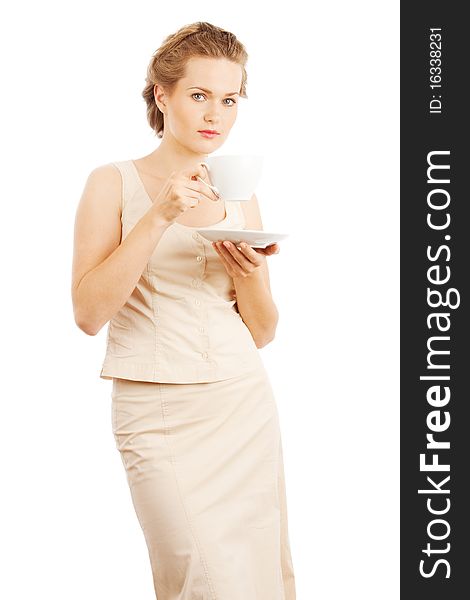 Young woman with cup of tea/coffee isolated on white