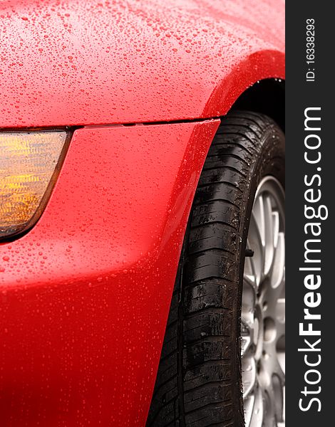 Water drops on an red sport car