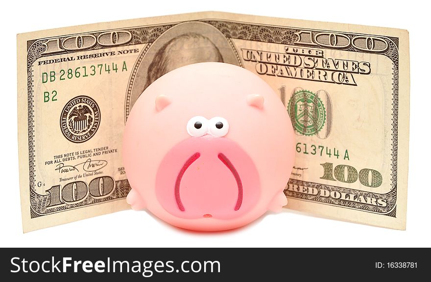 Toy pink pig and cash on a white background