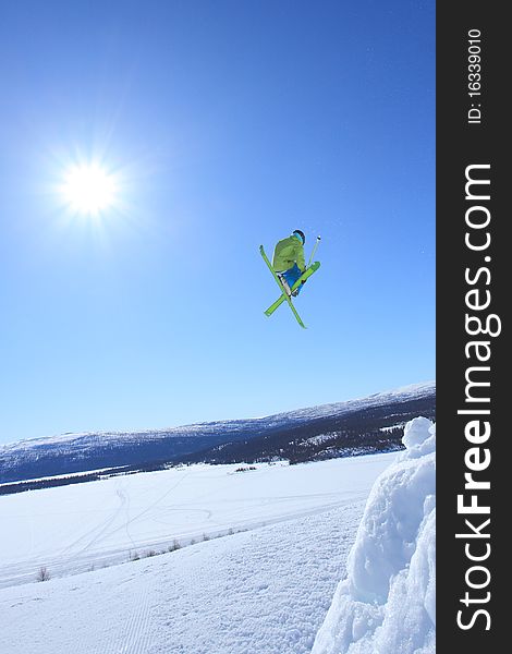 Young skier who jump high up in the air. Young skier who jump high up in the air