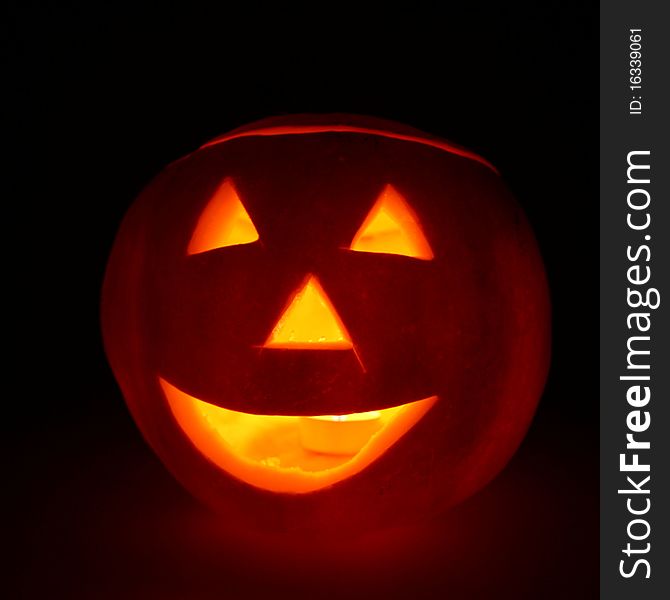 Jack-o-lantern glowing on black background