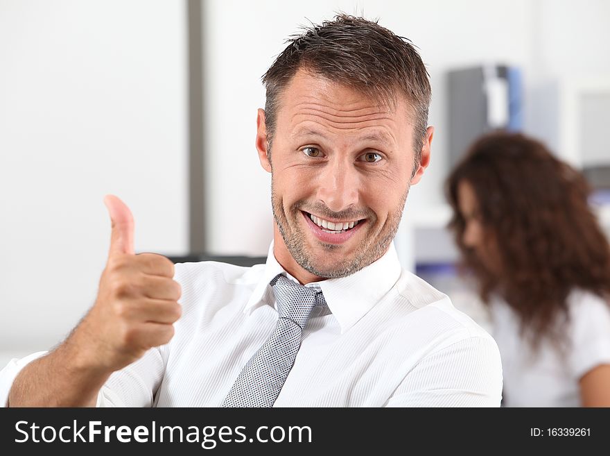 Happy businessman with thumb up. Happy businessman with thumb up