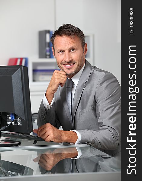 Closeup of businessman at his desk. Closeup of businessman at his desk